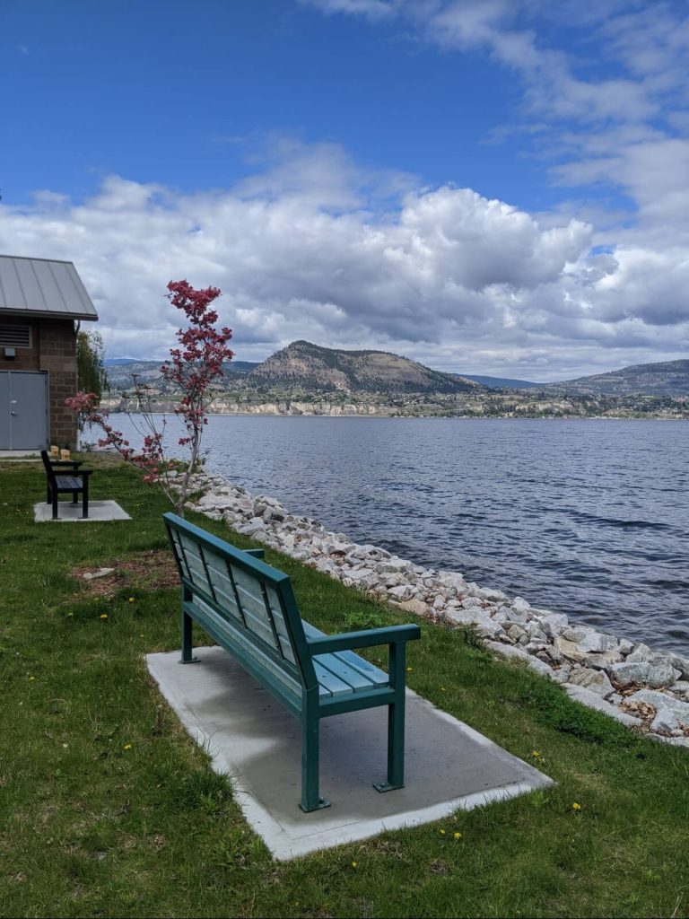 Bench in front of Okanagan lake view in Wharf Park, Naramata