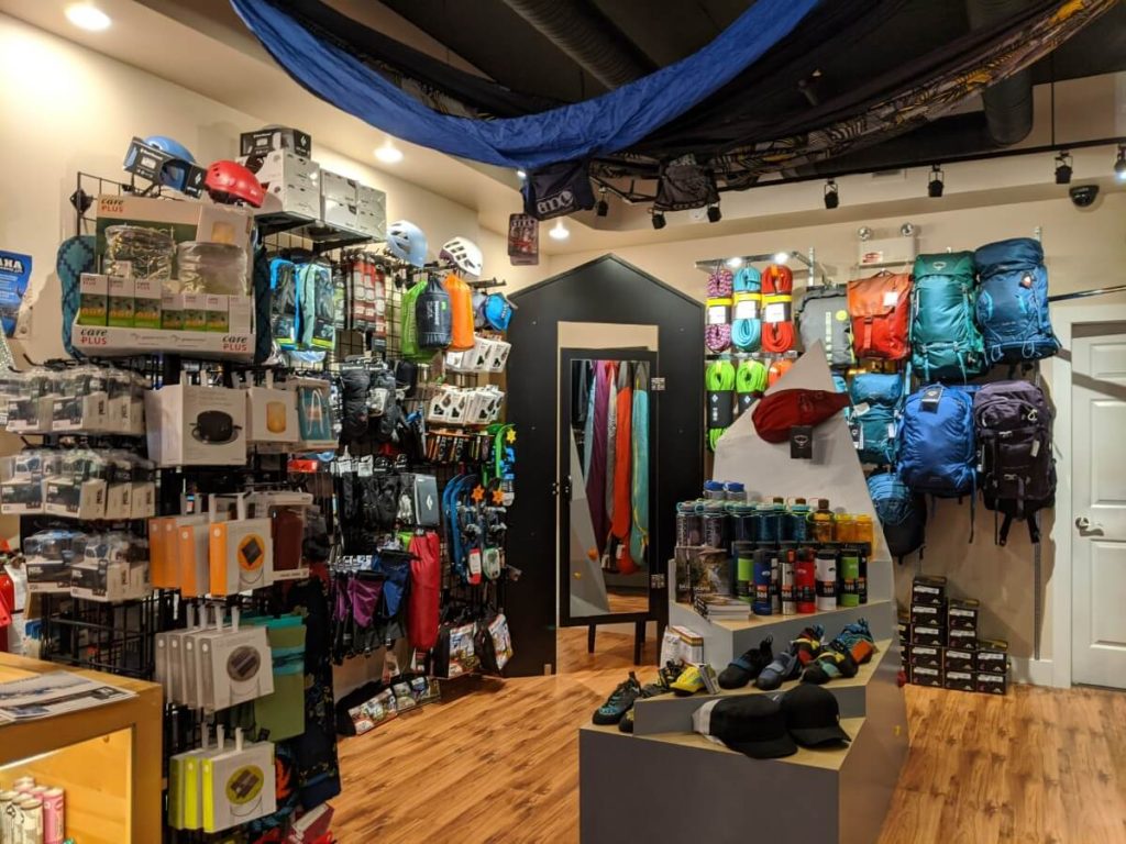 View from outdoor gear displayed on wall and shelves at Eskala Mountain Sports store in Penticton.