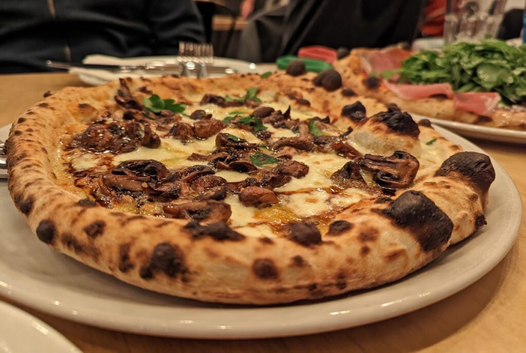 Close up of mushroom and cheese pizza at Pizzeria Tratto in Penticton